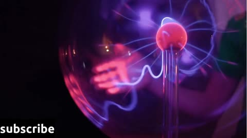 Boy touches to plasma globe