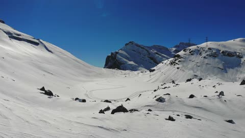 Man Sitting On a Rock In a Gemmi Pass