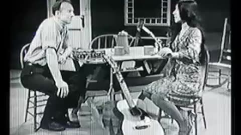 Buffy Sainte-Marie demonstrates the mouthbow to Pete Seeger