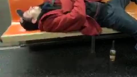 Drunk man passed out on subway train, takes up 4 seats