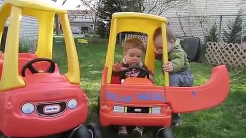 Babies fight over toy car