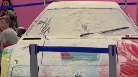 Climate activists throw flour at Andy Warhol car in Italy