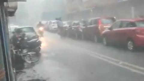 Guy Struggles to Walk Under Umbrella in Stormy Weather During Cyclone Tauktae in India