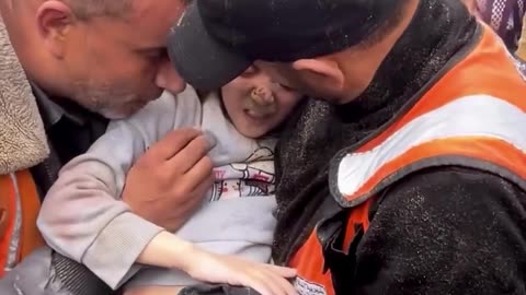 A Palestinian girl’s life is saved by rescue crews in Deir al-Balah