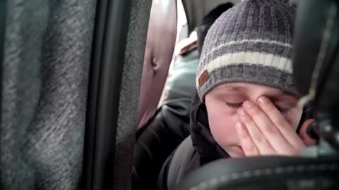 'We left our Dad in Kyiv' -little boy chokes back tears