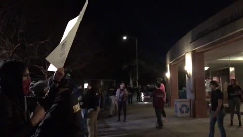 Jan 13 UC Davis Milo speech 3 the Antifa group tearing down the barricade entering building