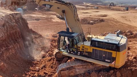 Caterpillar 365C Excavator Loading Trucks