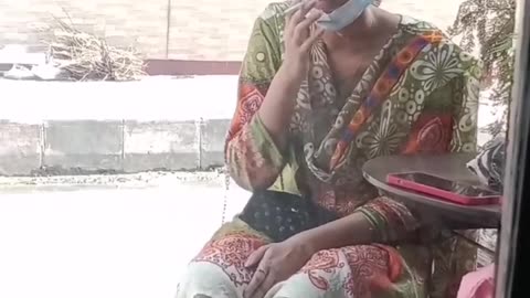 Bangladeshi girl smoking in public place