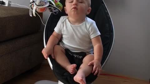 Baby Jax Struggles to Stay Awake in Rocker