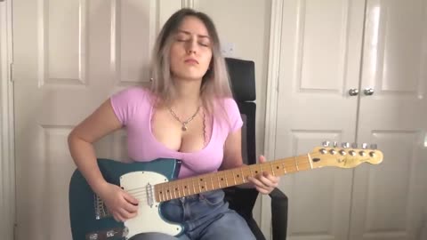 Mimi playing Albert King style guitar