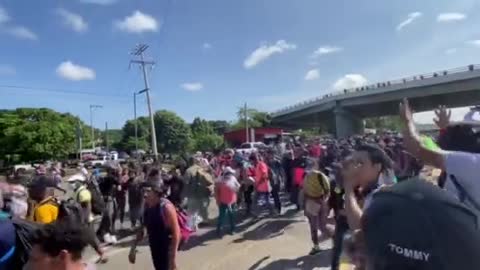 Migrant caravan has overrun a roadblock set up by forces of Mexican Instituto Nacional de Migración.