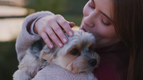 Beautiful woman With A Cute Dog On Her Shoulders video