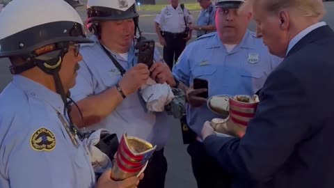 Trump Signs his Gold Sneakers for Philadelphia Law Enforcement Officers