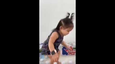 Little girl adorably dances to some techno beats