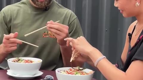 Jiri Prochazka Teaching Asian Woman How to Use Chopsticks