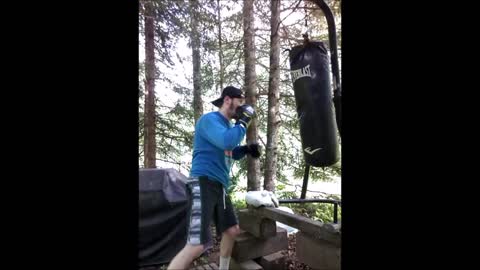 Hitting the 100 lb heavy bag while being bombed by mosquitoes