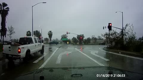 Running a Red Light on a Rainy Road