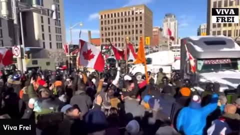 The People stand peacefully vs Cops while the Canadian National Anthem plays