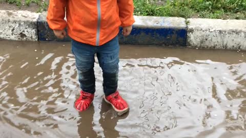 Little bully jumping in a puddle and funny grunts!