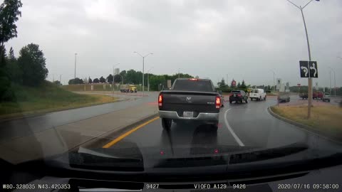 Dump Truck Loses Control in Roundabout