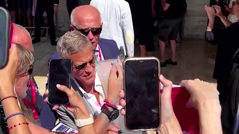 Brad Pitt, George Clooney joke around in Venice