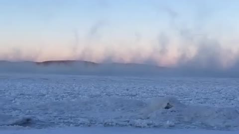 "Sea Smoke" eerily rises over Lake Superior