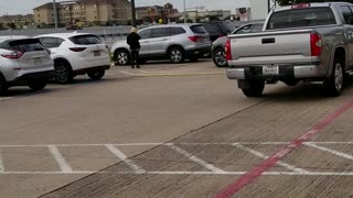 Woman almost hit in parking lot using Cell phone