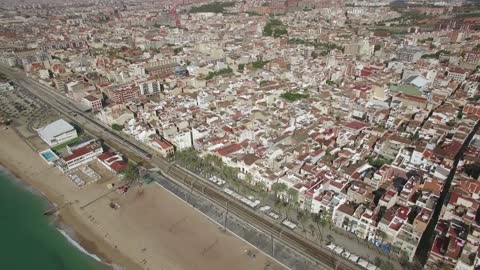 Drone flying by the coast of Barcelona