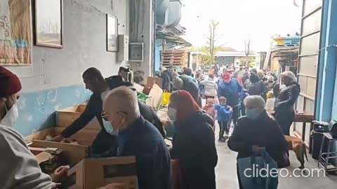 Milan Italy - The Insanity Continues... People lining up for loaves of bread...