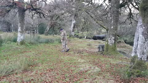 Measuring the trees distance apart. Before setting up a 4x4 tarp.