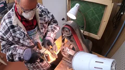 Custom knife maker making knives