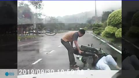 The man got accident because of the raincoat while driving motorbike