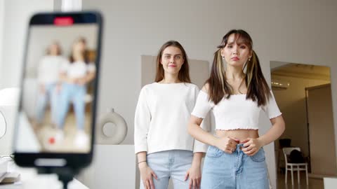 Two Young Women Recording a Dance Video