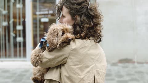 Woman Holding Her Dog