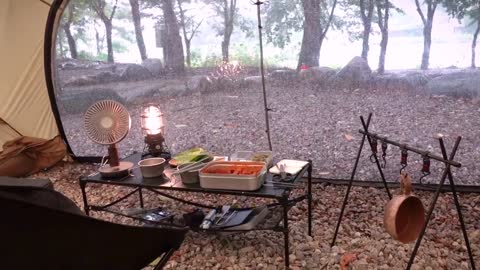 Single person outdoor camping, enjoying delicious food. Eating outside seems more delicious than at