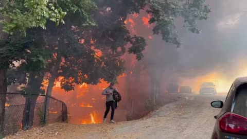 A massive fire is burning down homes in San Bernardino County.