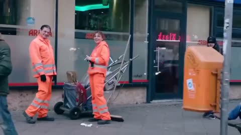 Why is everyone so happy to see this Hitler Lookalike business man? in Germany