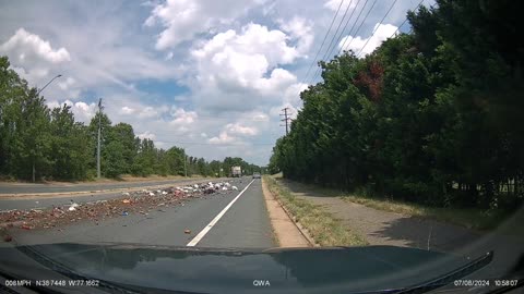 Garbage Truck Leaves Trash Strewn All Over Road