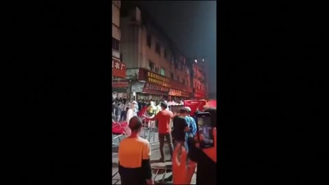 Crowds in Guangzhou crash through barricades and march down streets to protest COVID-19 curbs