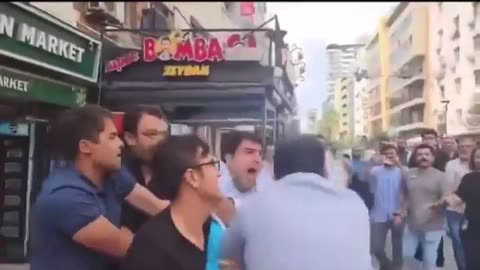 A group of people put sack on the head of an American Sailors in Izmir, Turkey.