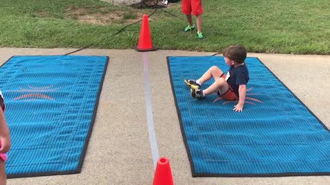 Adorable Little Boy Hilariously Struggles To Crawl Across Finish Line