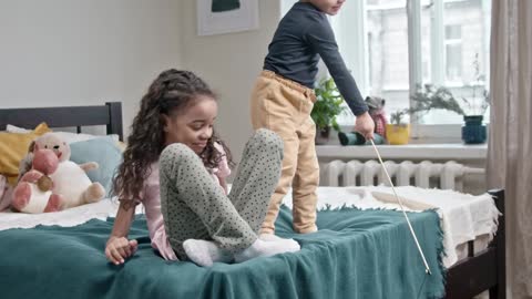 children and cat playing