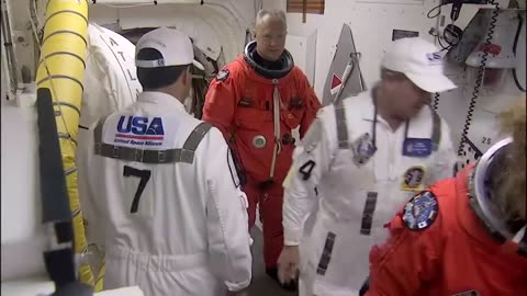 STS-135 Astronauts Strap Into Shuttle Atlantis