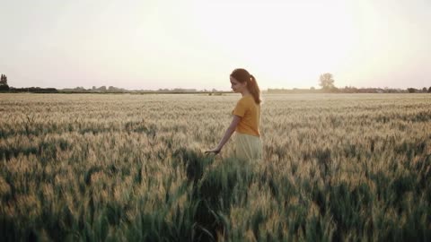 Best view of sunset, green grass, and beautiful girl