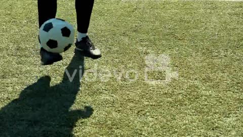 Close Up Of An Unrecognizable Soccer Player Training Freestyle Tricks With The Ball O A Street Footb