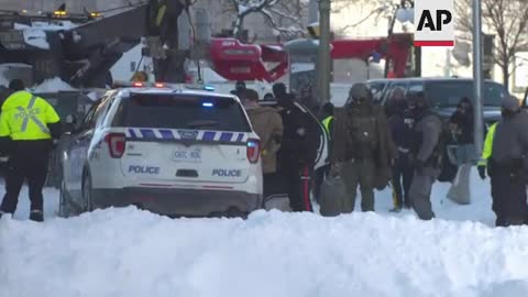 Canadian police arrest protesters, tow van in Ottawa