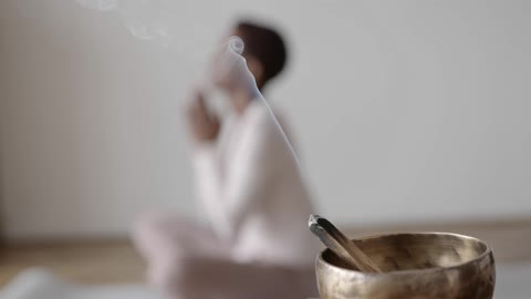 A Palo Santo On A Tibetian Singing Bowl