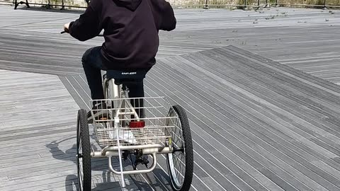 Spencer riding his tricycle at Jones beach air show VID_20230521_132314