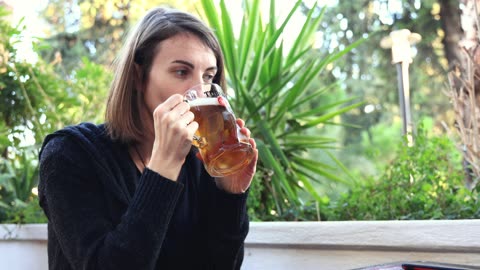 Lady drinking beer