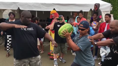 Karate chopping a water melon